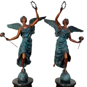 Bronze angel statue verdigris patina trumpet front left angle view
