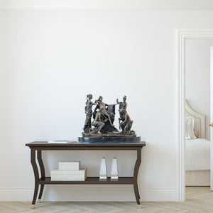 Bronze Apollo and the Nymphs sculpture displayed in indoor gallery room showing full scale setting