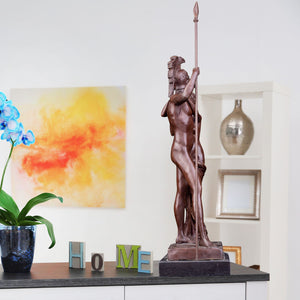 Bronze Ares and Aphrodite Greek mythology sculpture in art gallery setting with colorful background