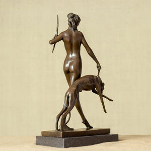 Front close-up of bronze Artemis Greek goddess statue in standing pose holding spear with greyhound