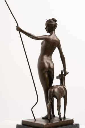 Back view of bronze Artemis mythology sculpture on polished marble base