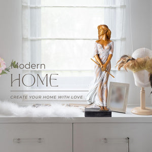 Bronze elegant woman with flute statue displayed in bright white kitchen interior