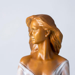 Bronze elegant woman with flute statue living room natural light plants background