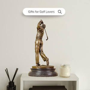 Bronze golfer statue business express gift wrap beside plants green interior