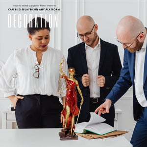 Bronze Lady Justice Themis statue during male and female lawyer consultation as professional gift