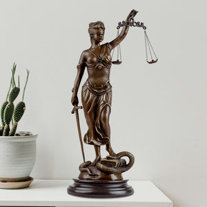 Bronze Lady Justice Themis statue front full body view on white background showing scales and sword detail