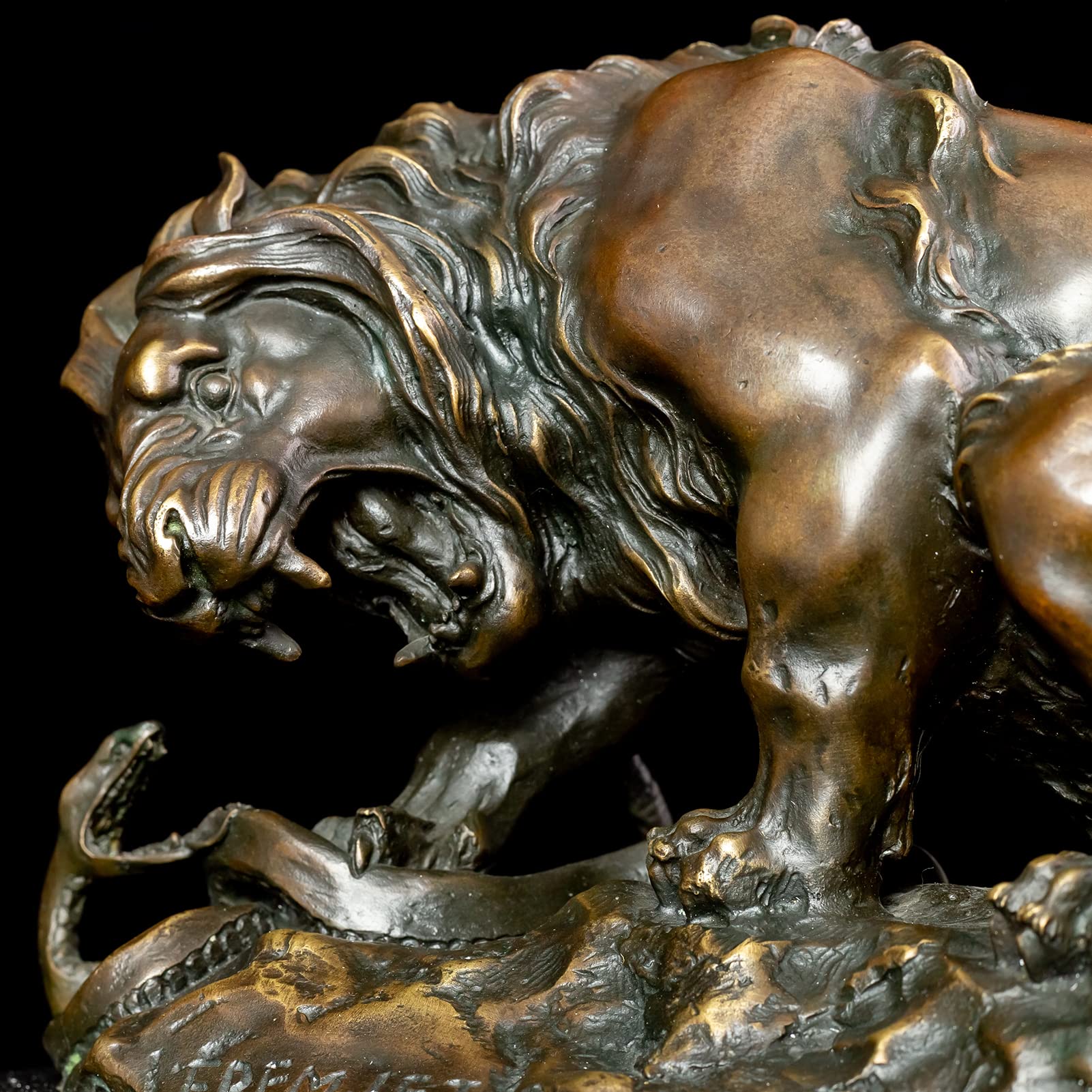 Close-up front detail of dark bronze lion mane and serpent interaction in Barye masterpiece sculpture