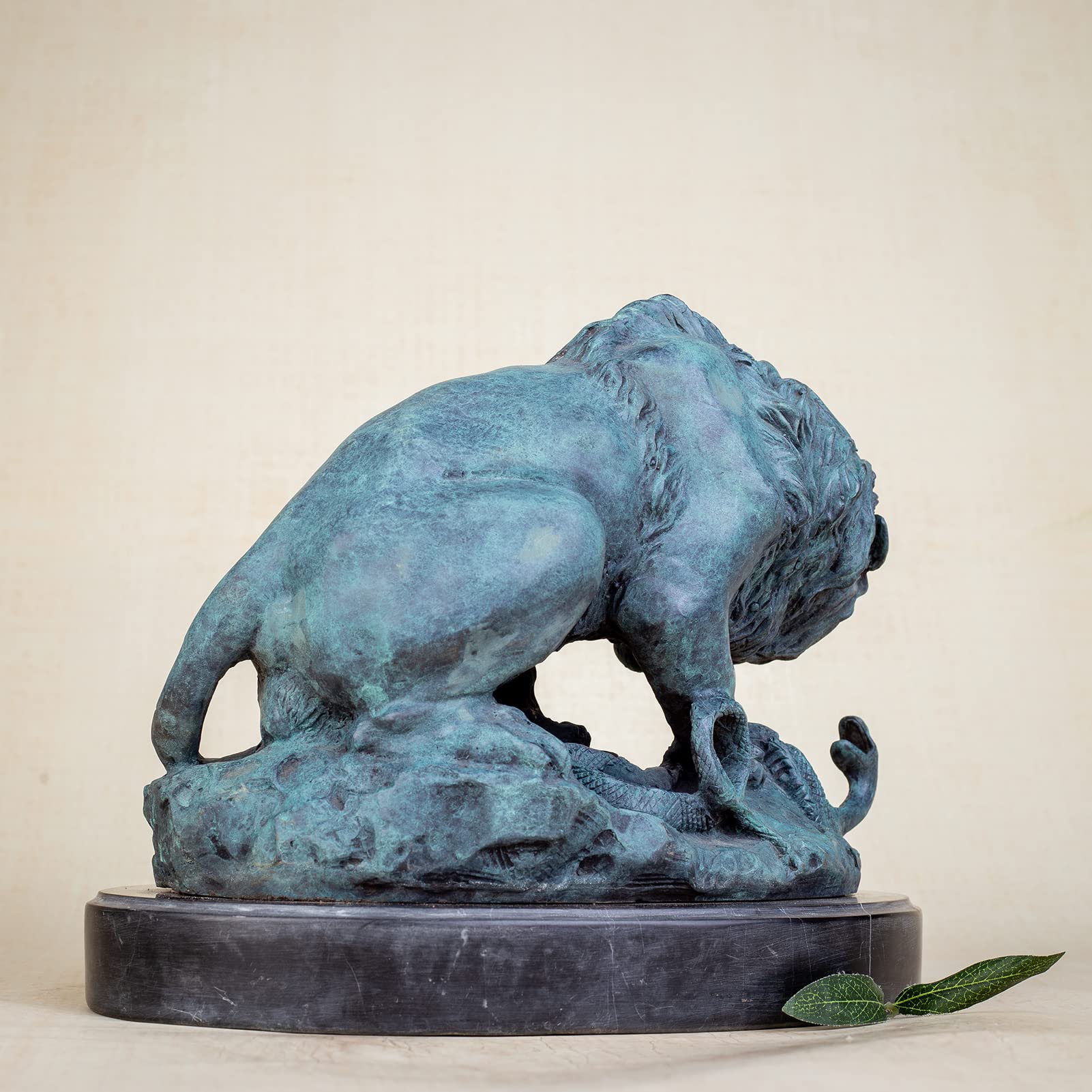 Close-up detail of serpent and lion paw interaction in hand-cast bronze Barye fine art sculpture