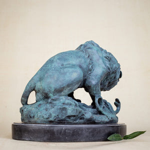 Close-up detail of serpent and lion paw interaction in hand-cast bronze Barye fine art sculpture