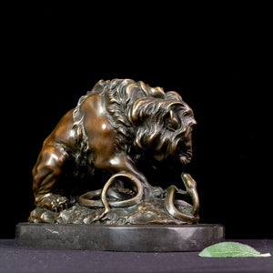 Back angle of dark bronze lion and serpent fine art sculpture after A. Barye on black background