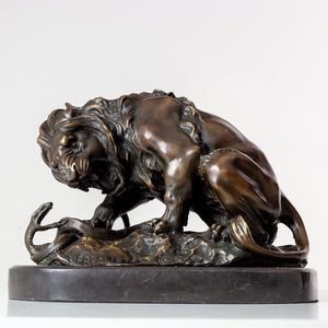 Dark bronze patina lion and serpent sculpture after Barye on marble base, side view beige background