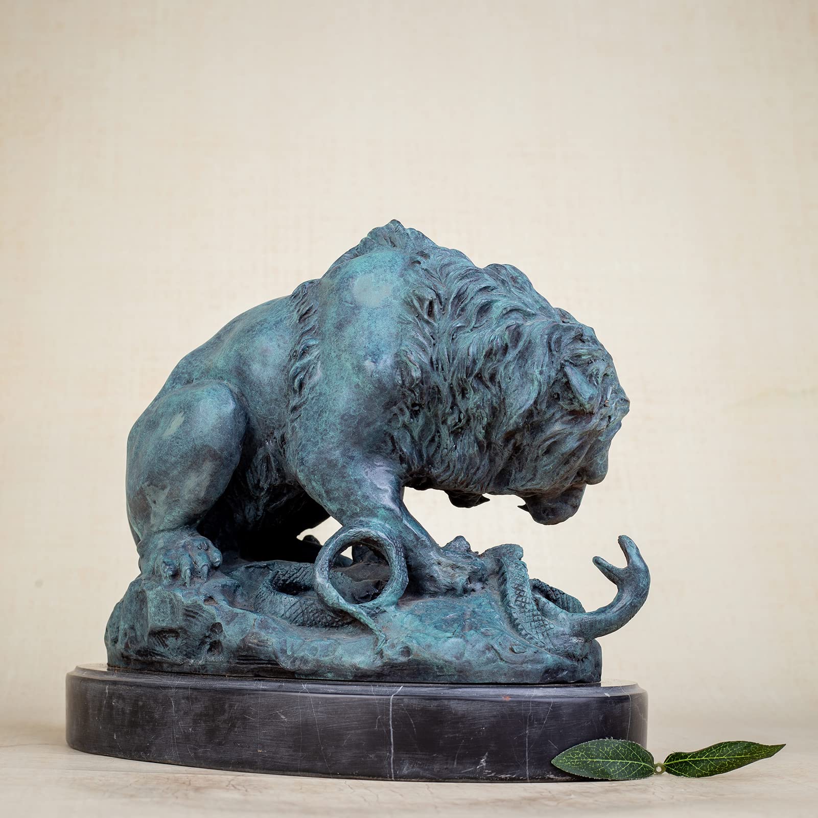 Back angle view of teal patina bronze lion and serpent sculpture after A. Barye on marble base