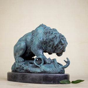 Back angle view of teal patina bronze lion and serpent sculpture after A. Barye on marble base