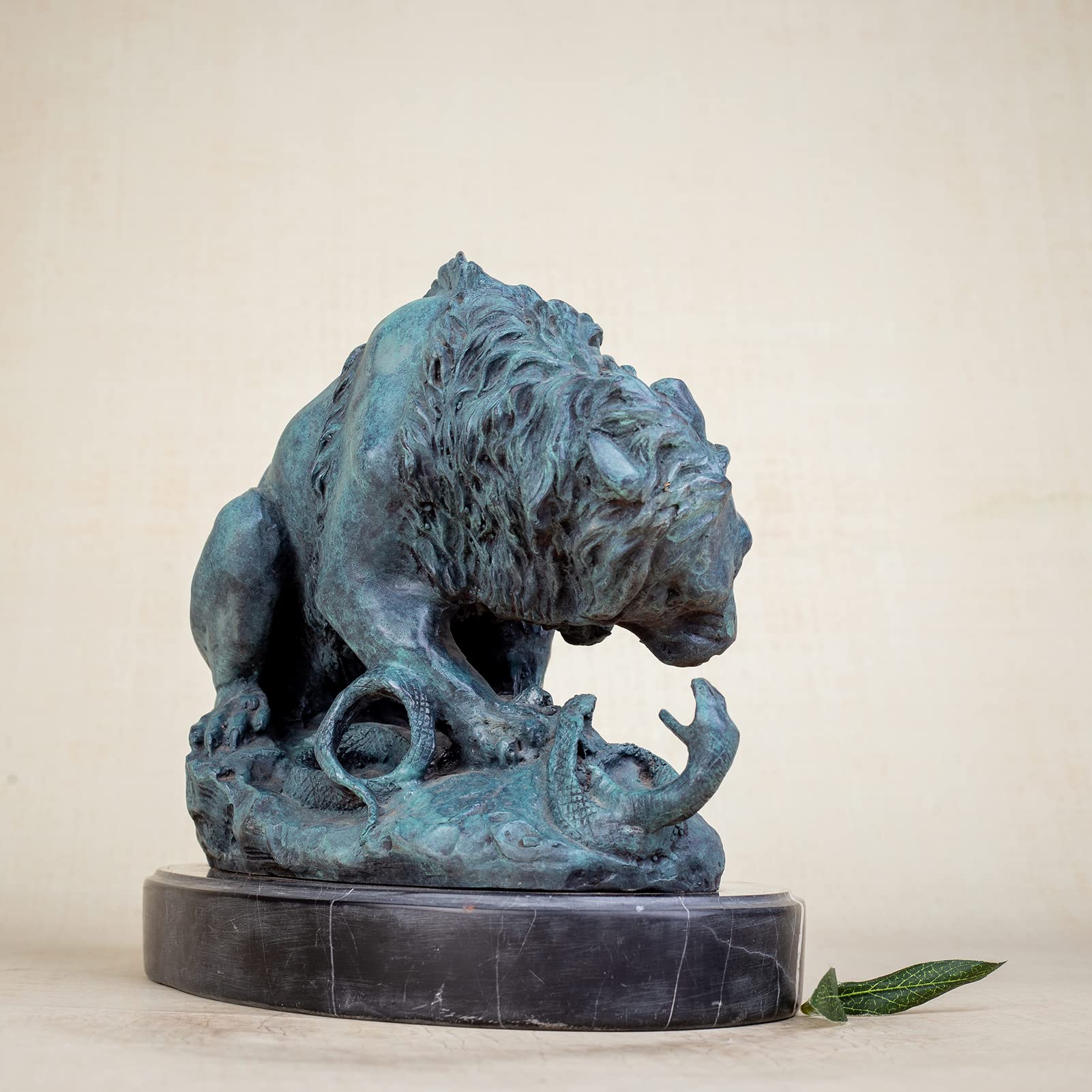 Front angle view of teal patina bronze lion and serpent Barye masterpiece sculpture on marble base