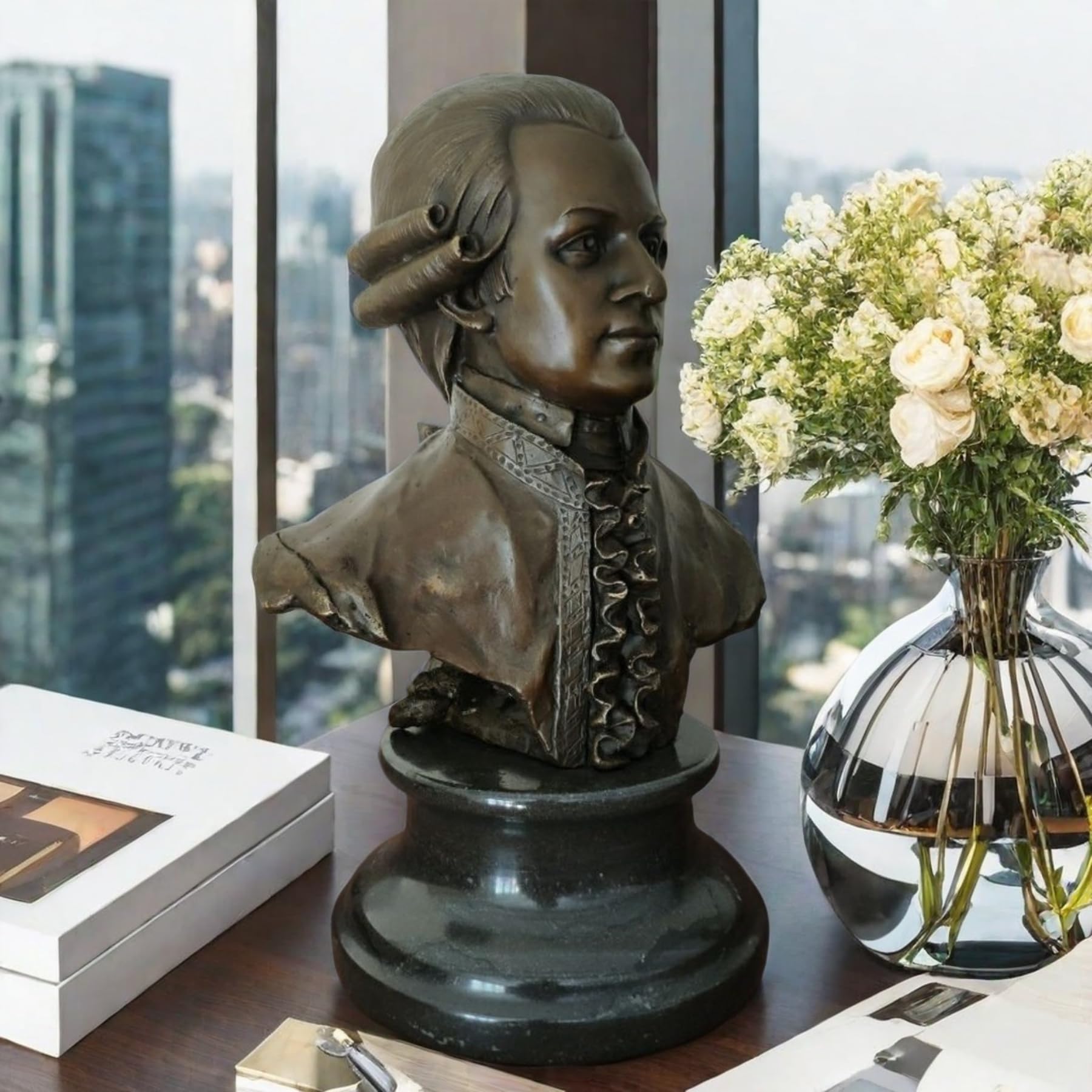 Bronze Mozart bust statue displayed indoors with floral arrangement lifestyle setting