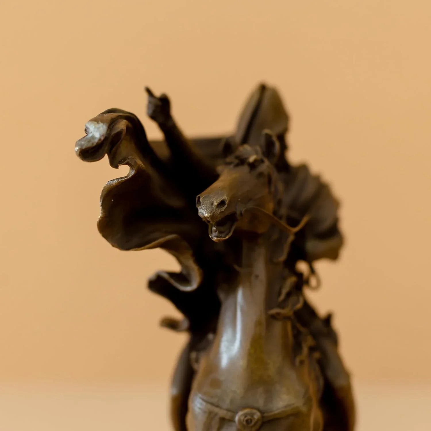 Back angle detail view of bronze Napoleon Crossing the Alps statue showing cape and saddle detail