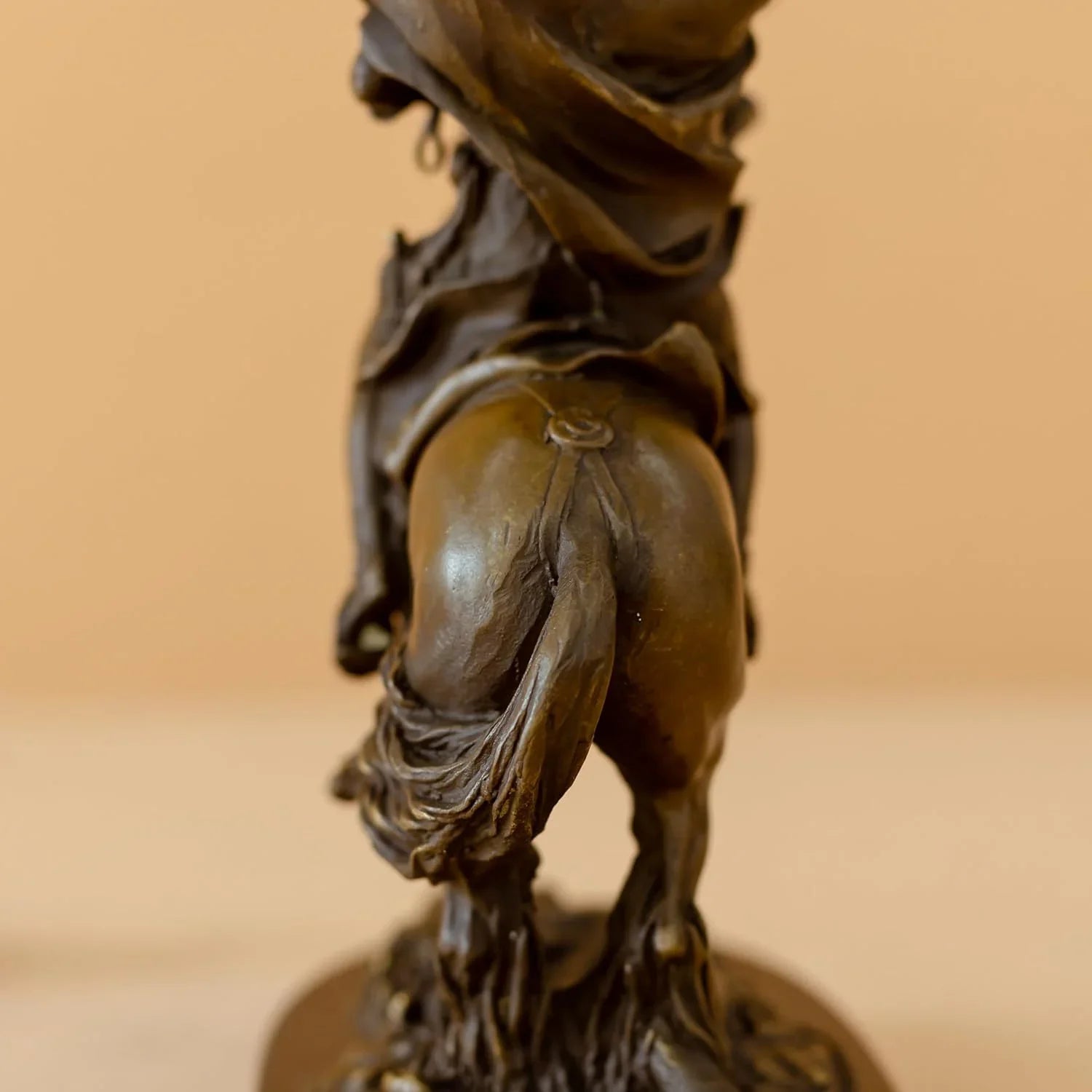 Side view of bronze Napoleon Crossing the Alps statue showing horse tail and base rock detail