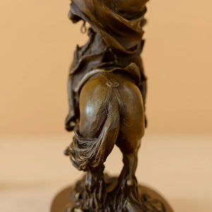 Side view of bronze Napoleon Crossing the Alps statue showing horse tail and base rock detail