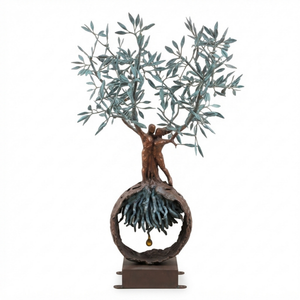 An isolated, 1.2-meter-tall handcrafted bronze olive tree and embracing couple sculpture displayed against a clean white background, featuring intertwined trunks, detailed verdigris leaves, and a spherical root base with a hanging golden drop.