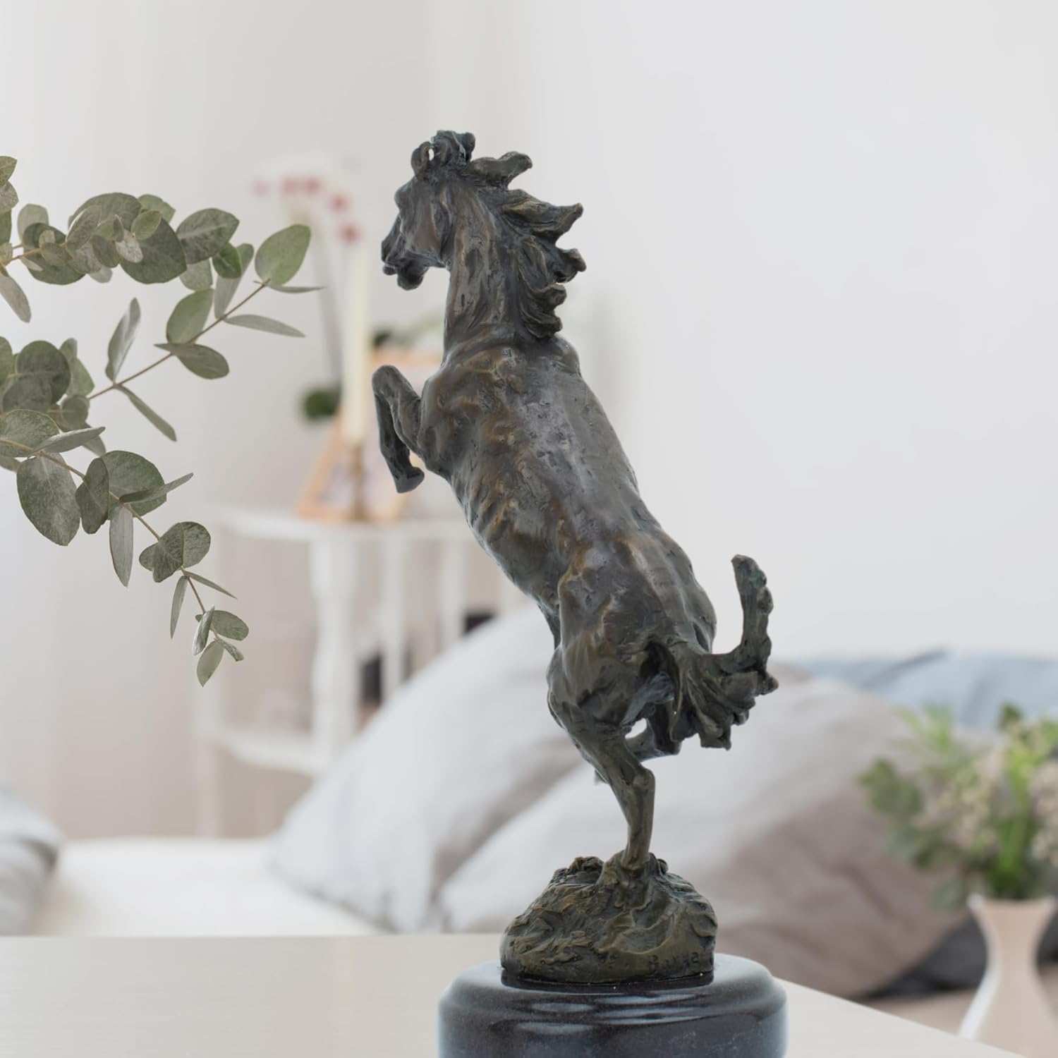 Bronze rearing stallion statue side full body view on white background showing dynamic rearing pose