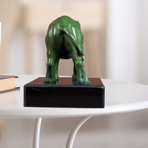 Back view of the bronze rhinoceros sculpture on a black base, showcasing craftsmanship.