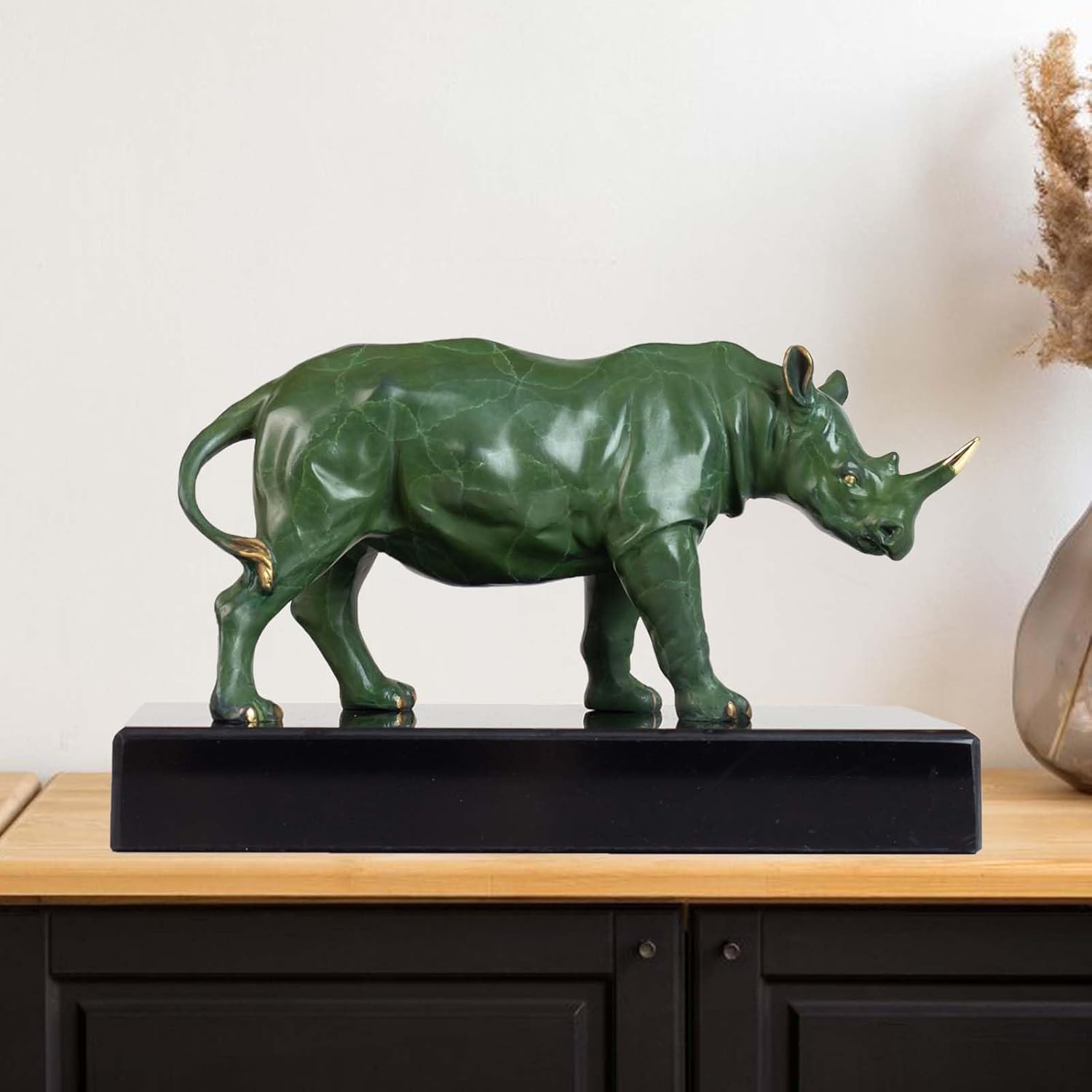 7.87-inch bronze rhinoceros sculpture on a sleek black base, front view.