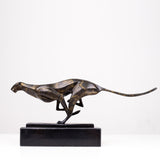 Dark bronze running cheetah sculpture on black marble base side view display