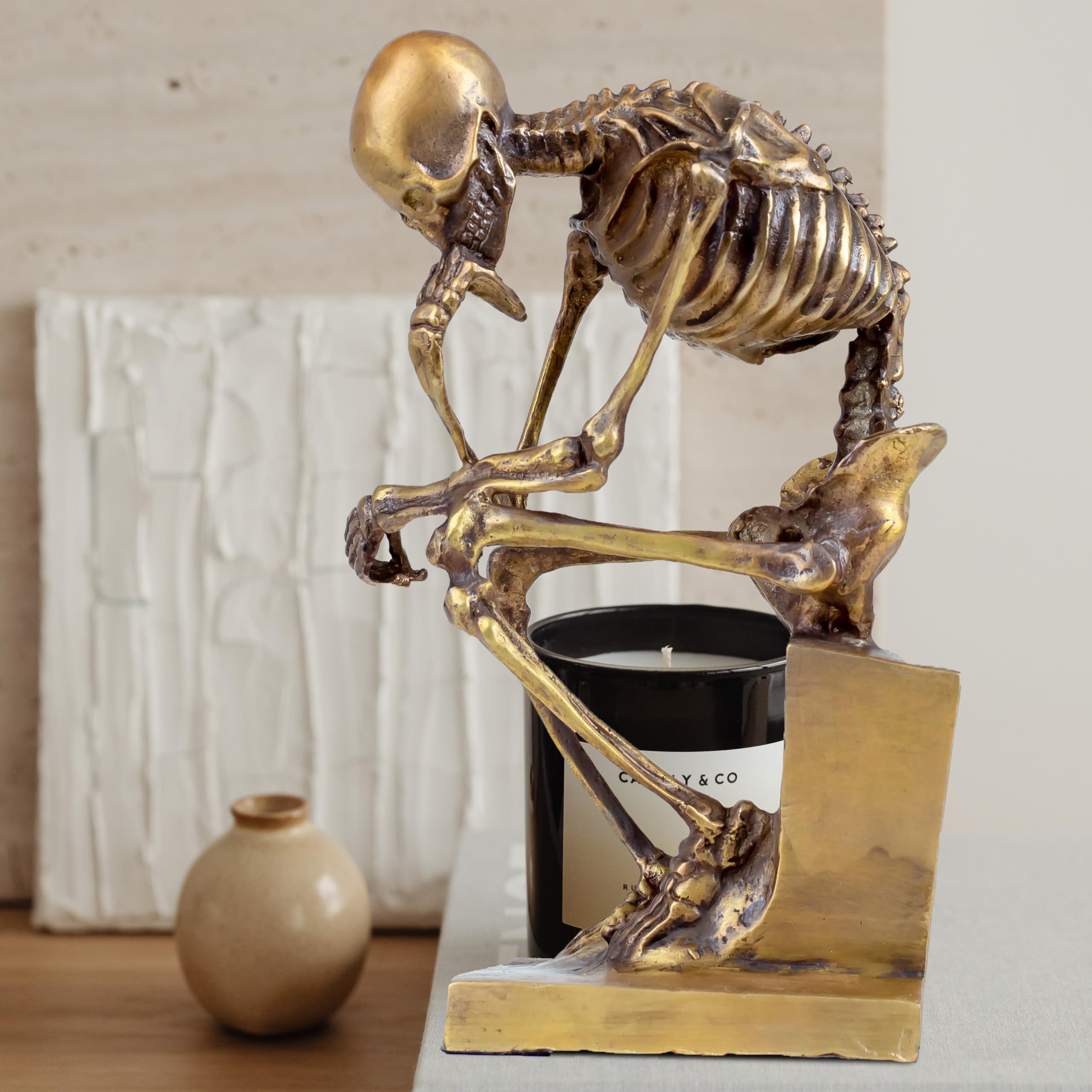 Bronze skeleton Thinker statue in gold finish on desk with size dimension reference
