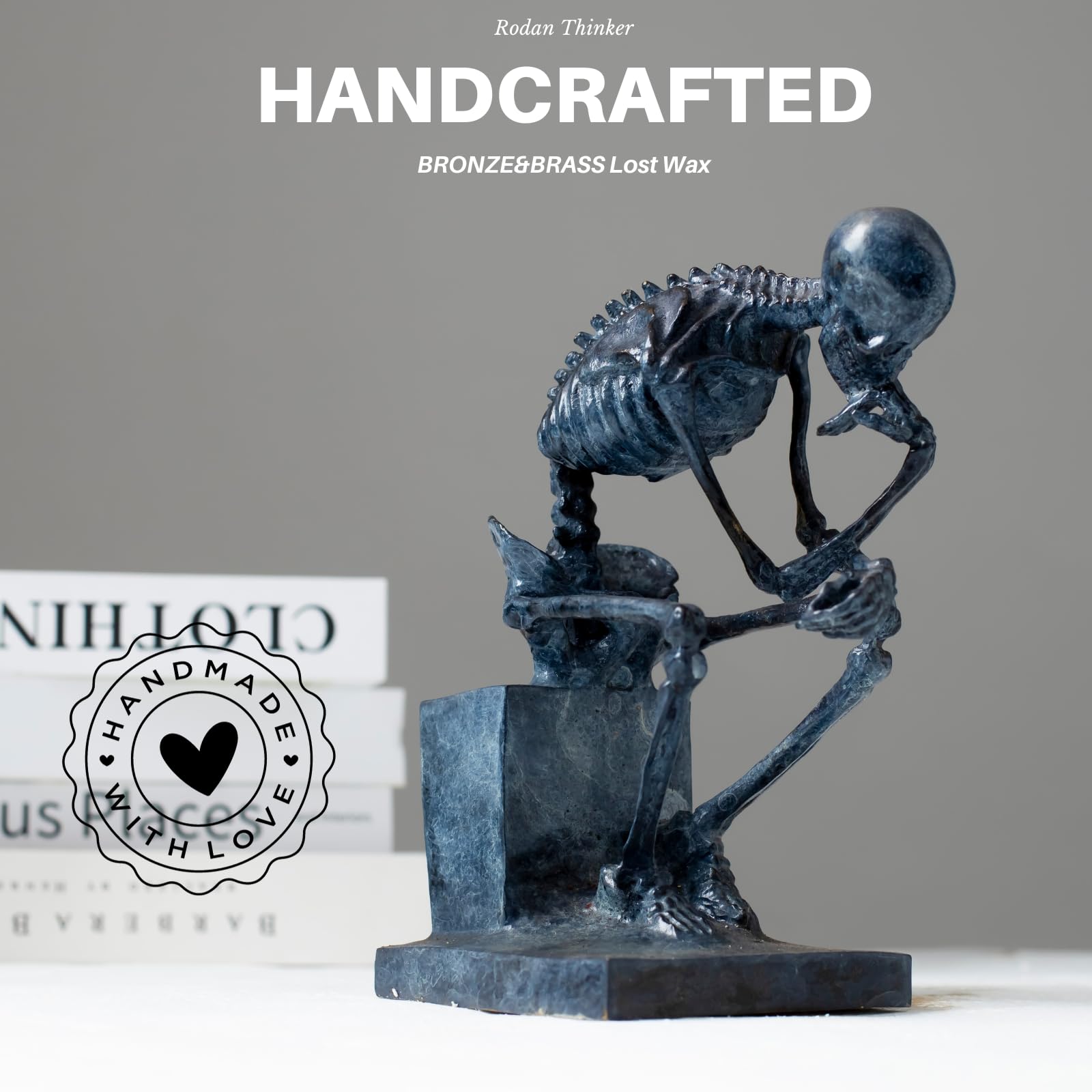 Bronze skeleton Thinker statue handcrafted feature card displayed beside books