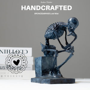 Bronze skeleton Thinker statue handcrafted feature card displayed beside books