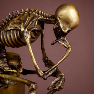 Bronze skull Thinker statue feature card highlighting handmade craftsmanship and bronze material