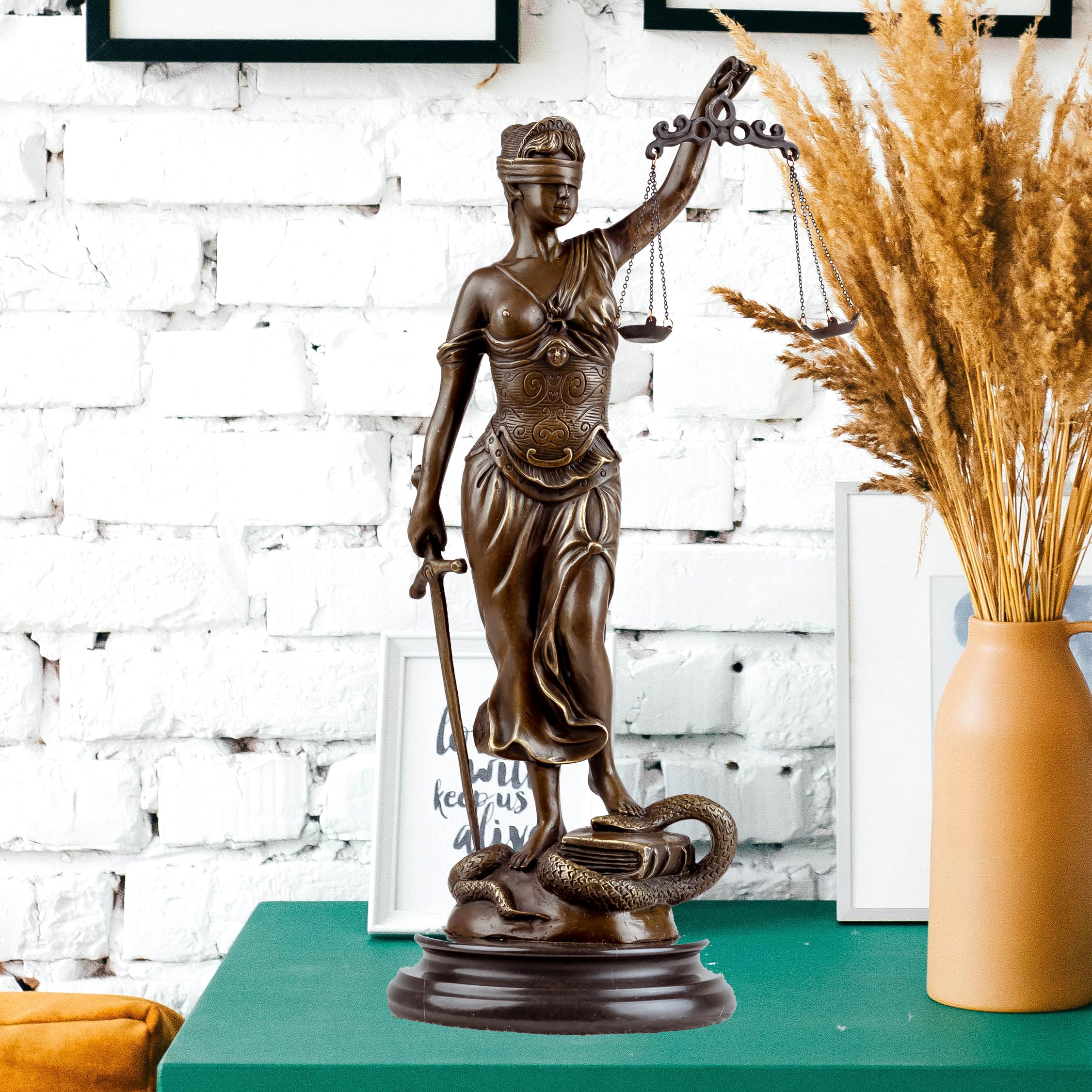 Full body side view of bronze Themis Lady Justice statue in professional office interior setting