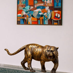 Bronze tiger statue displayed poolside outdoor garden luxury setting