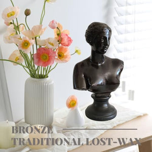 Bronze Venus de Milo bust statue displayed alongside dried flower arrangement in front view