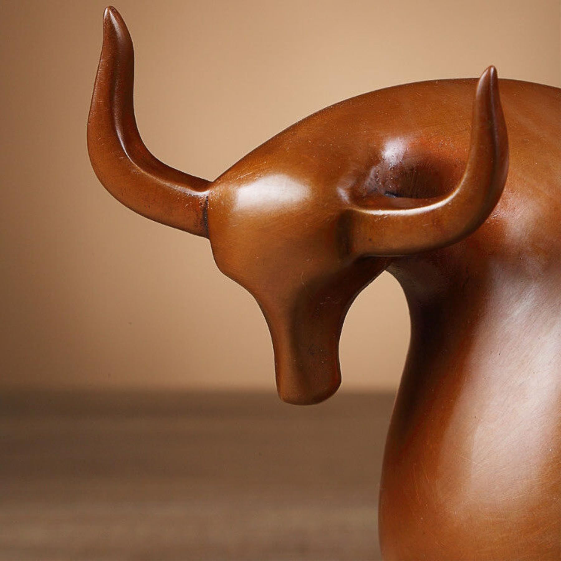 Elegant brown bronze bull figurine for home and office decoration.