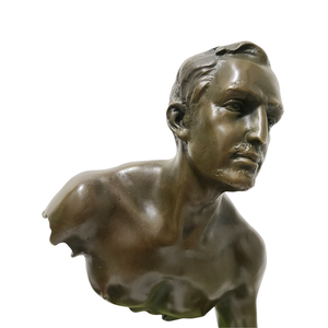Close-up face and upper body detail of Bruno Catalano Les Voyageurs seated bronze sculpture