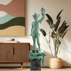 Cellini Perseus Medusa green bronze sculpture displayed at home entrance with Christmas tree