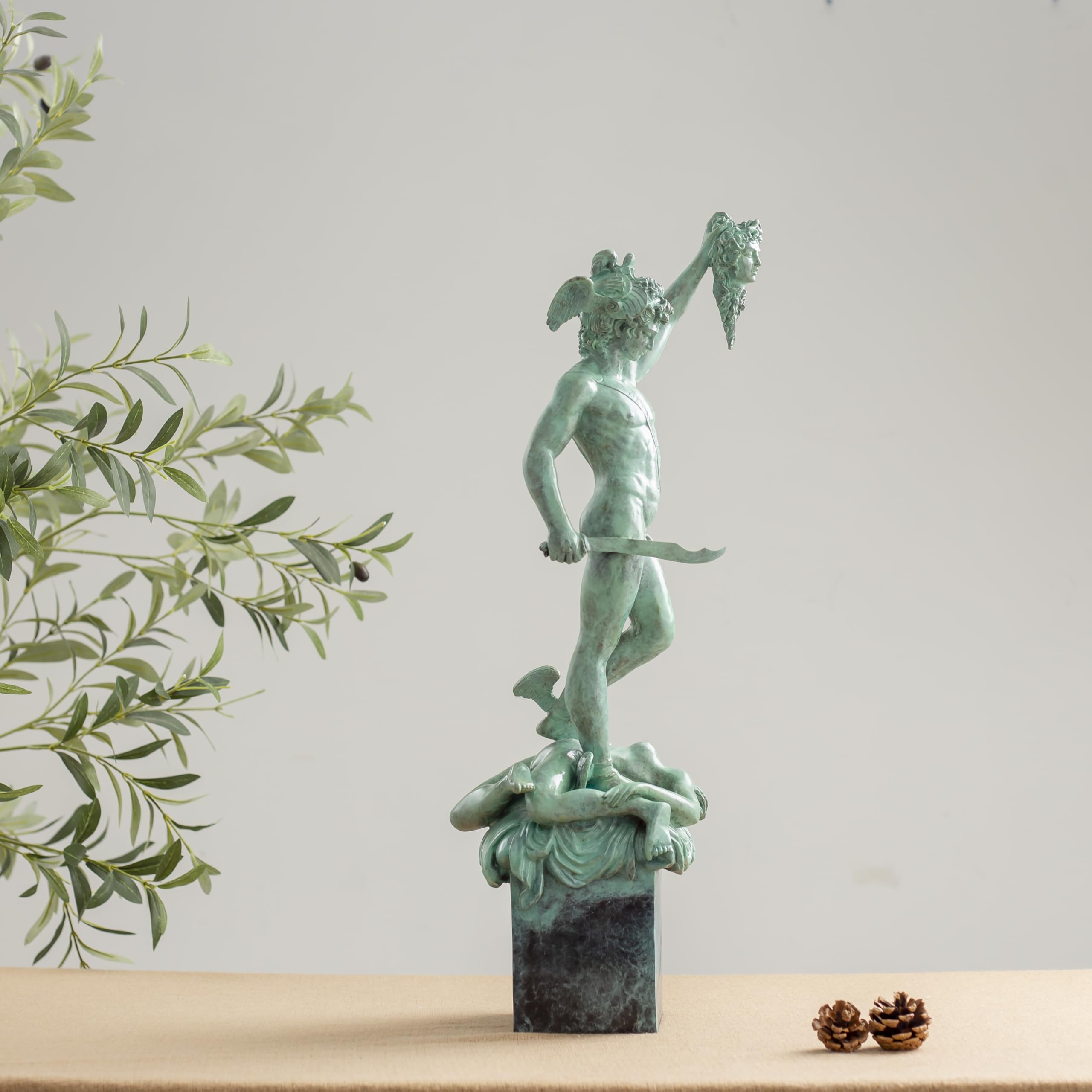 Benvenuto Cellini Perseus holding Medusa head bronze sculpture green patina front view