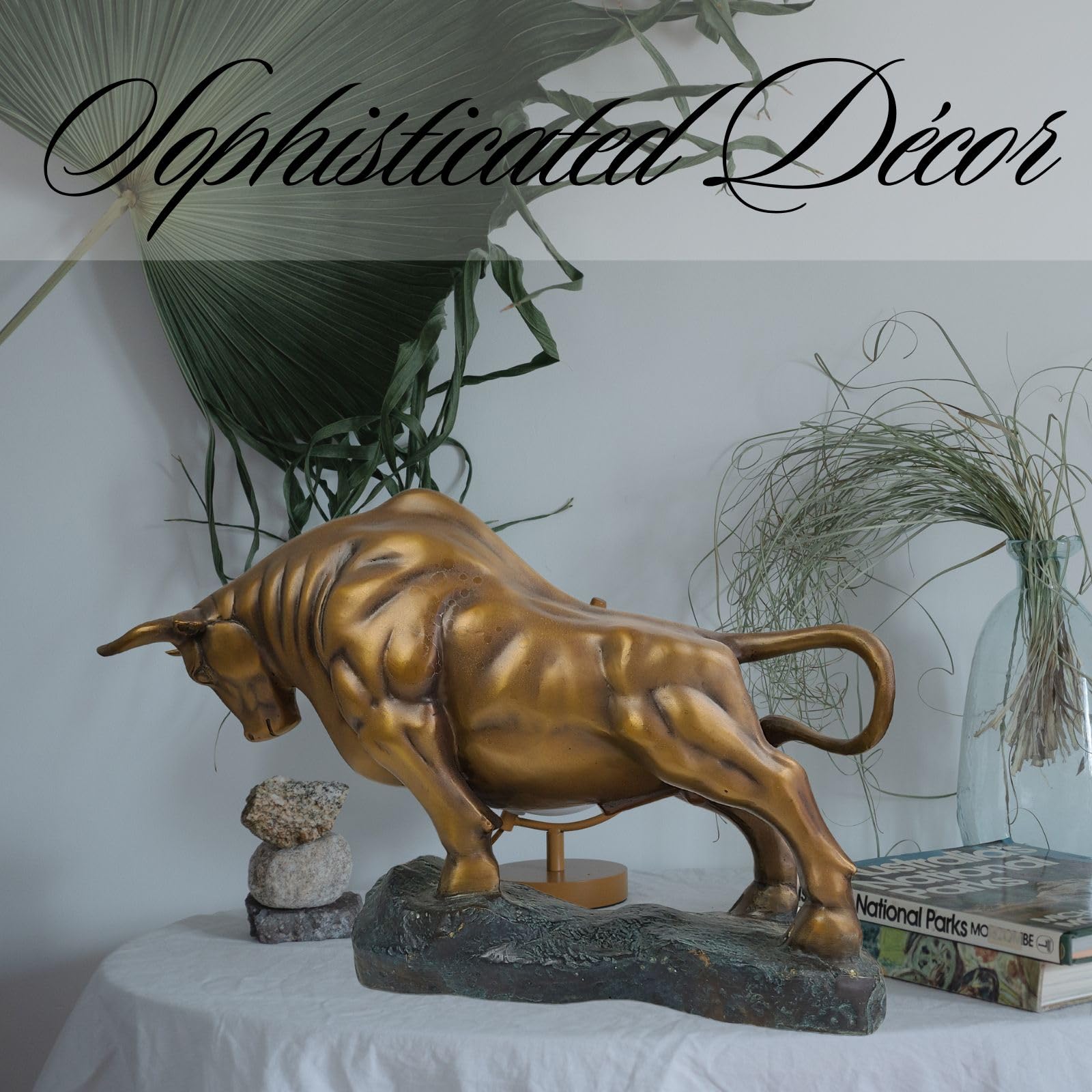 Antique bronze charging bull displayed on executive desk decor.