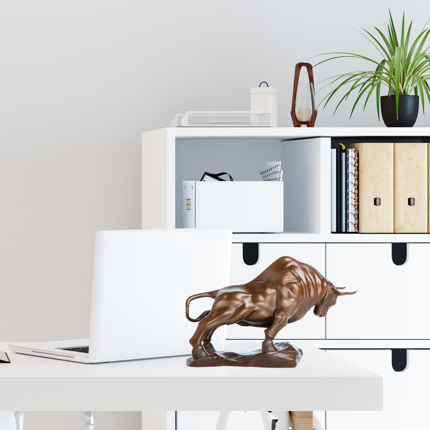 Bronze bull figurine styled on an executive office desk.