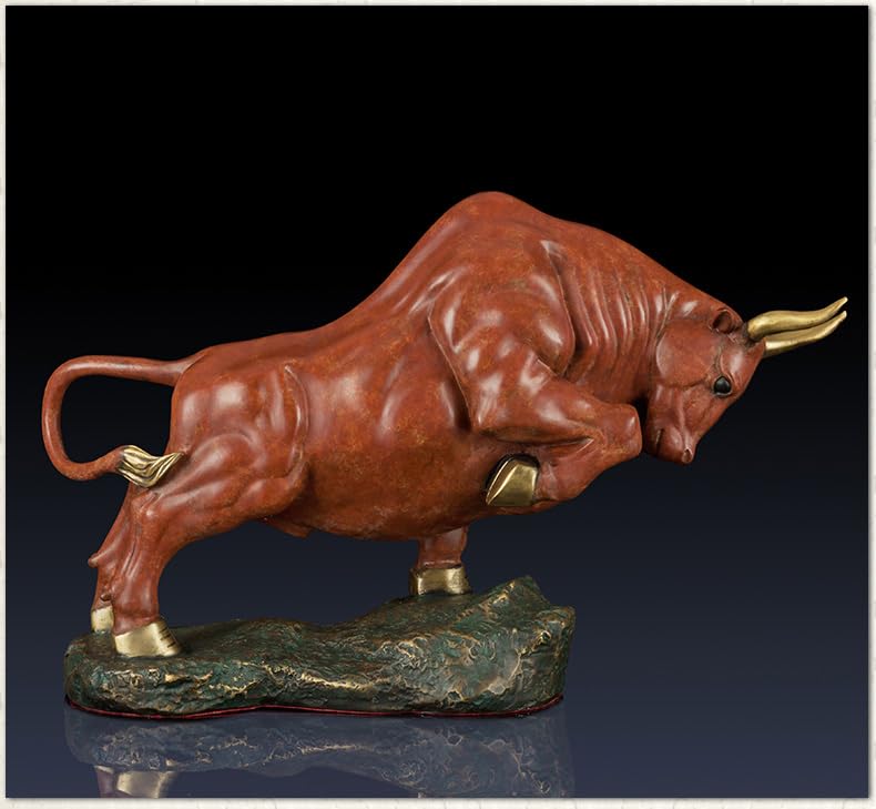 Handcrafted orange-red charging bull statue, front view.