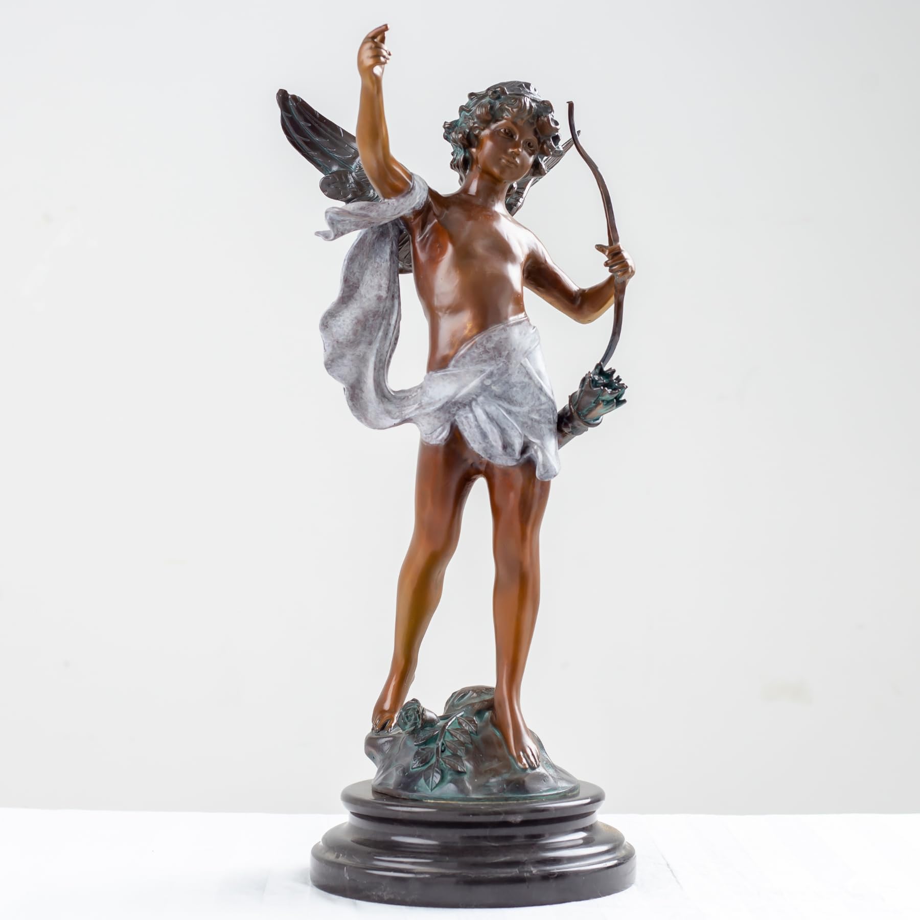 Cupid bronze sculpture classic patina with bow full view marble base white background