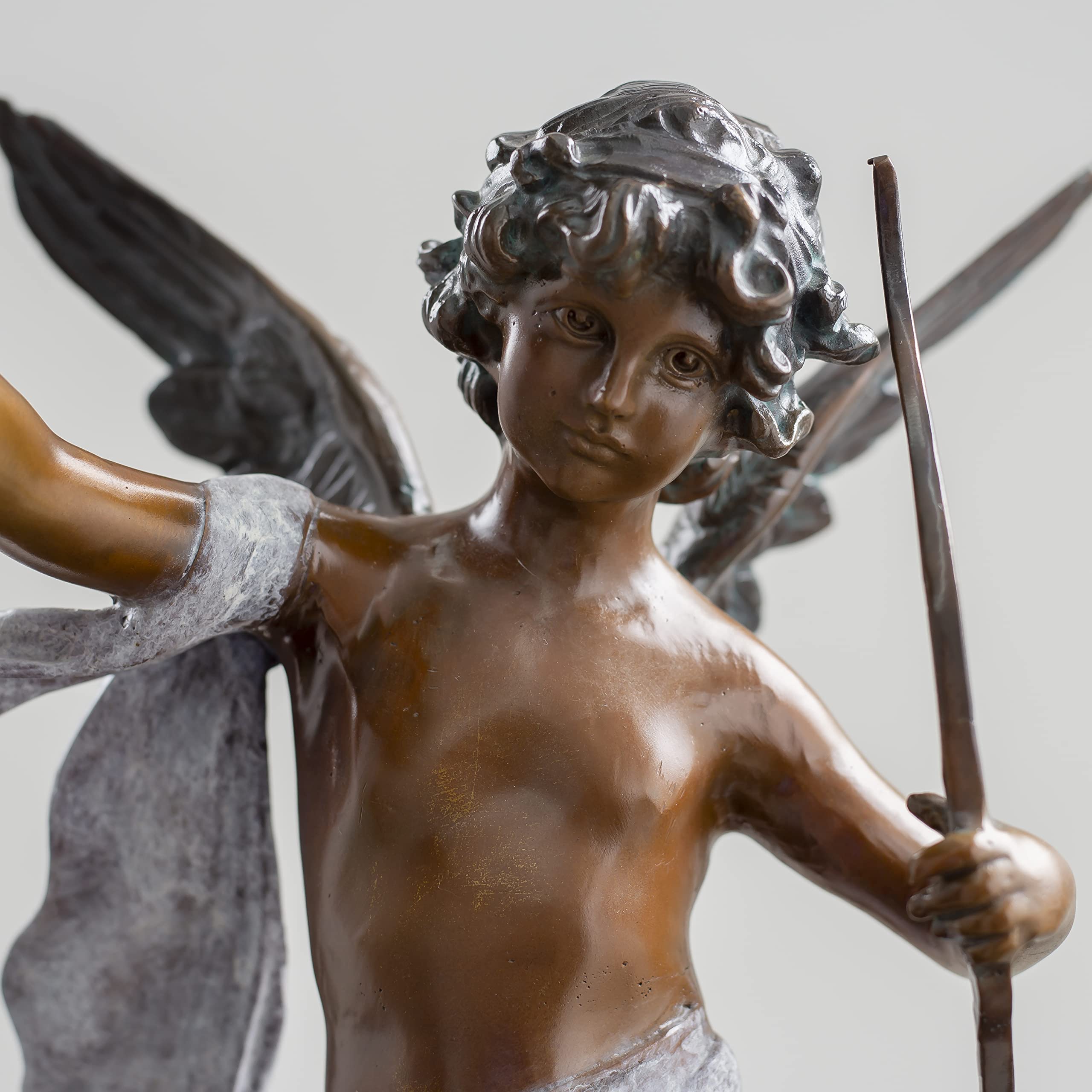 Cupid bronze sculpture classic patina torso and wing detail close up