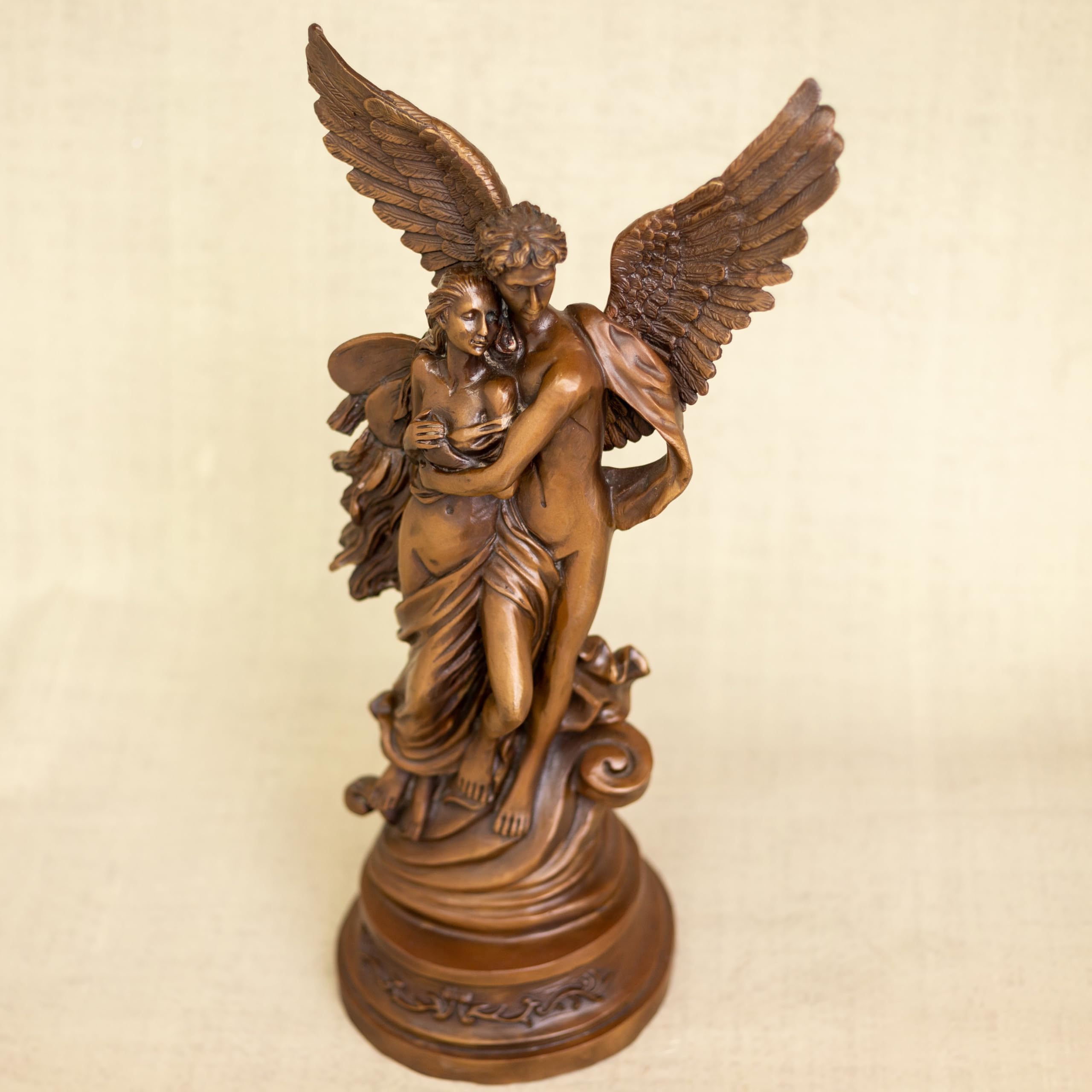 Cupid Psyche bronze sculpture face and wing detail close up copper patina craftsmanship