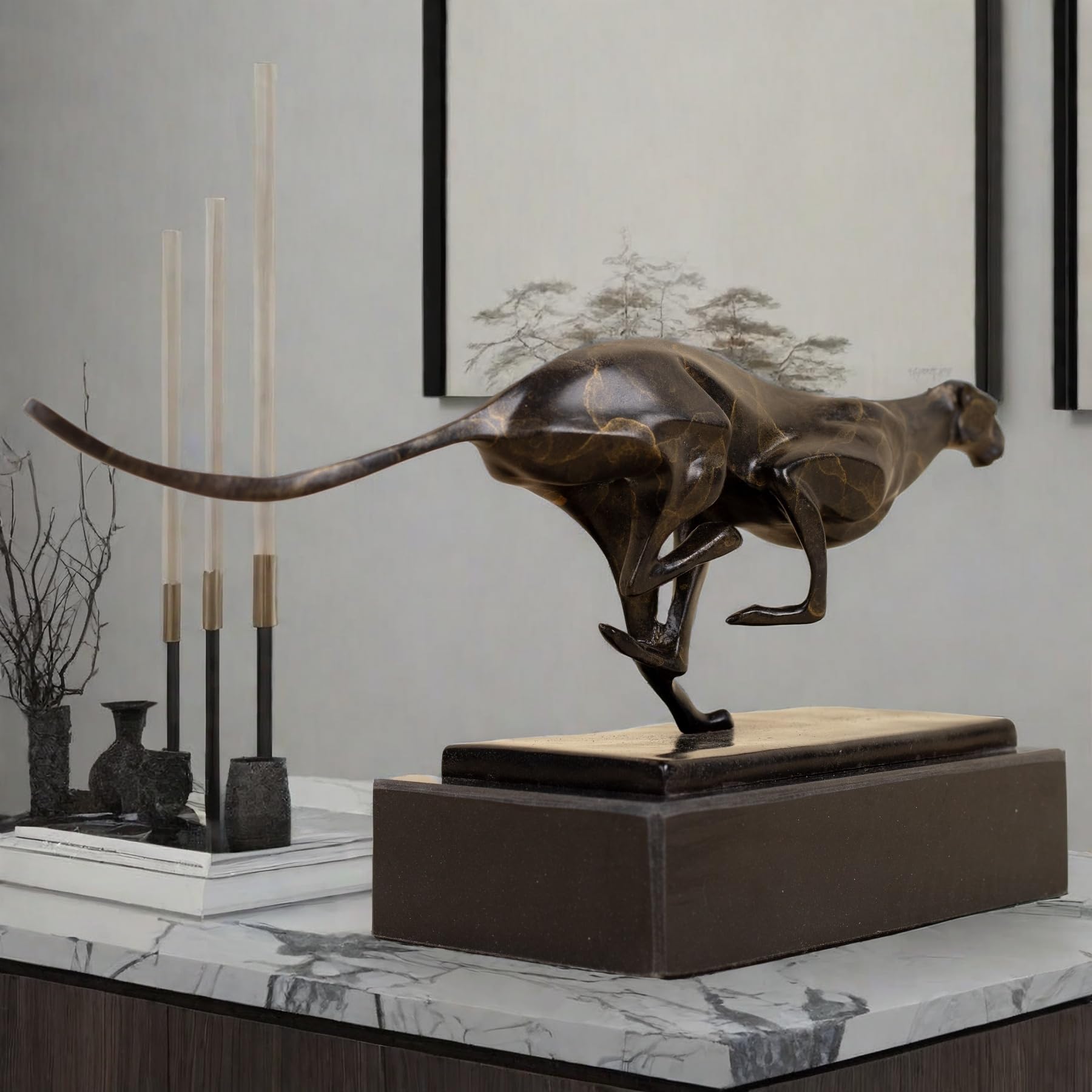 Dark bronze running cheetah sculpture on black marble base displayed on marble table luxury interior