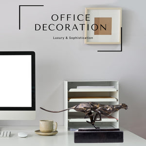 Dark bronze running cheetah sculpture displayed as office decoration on modern desk setting