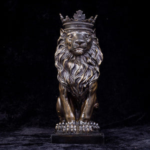Dark bronze crowned Lion King sitting sculpture front view against black background display