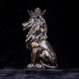 dark bronze crowned Lion King sitting statue front view against black background