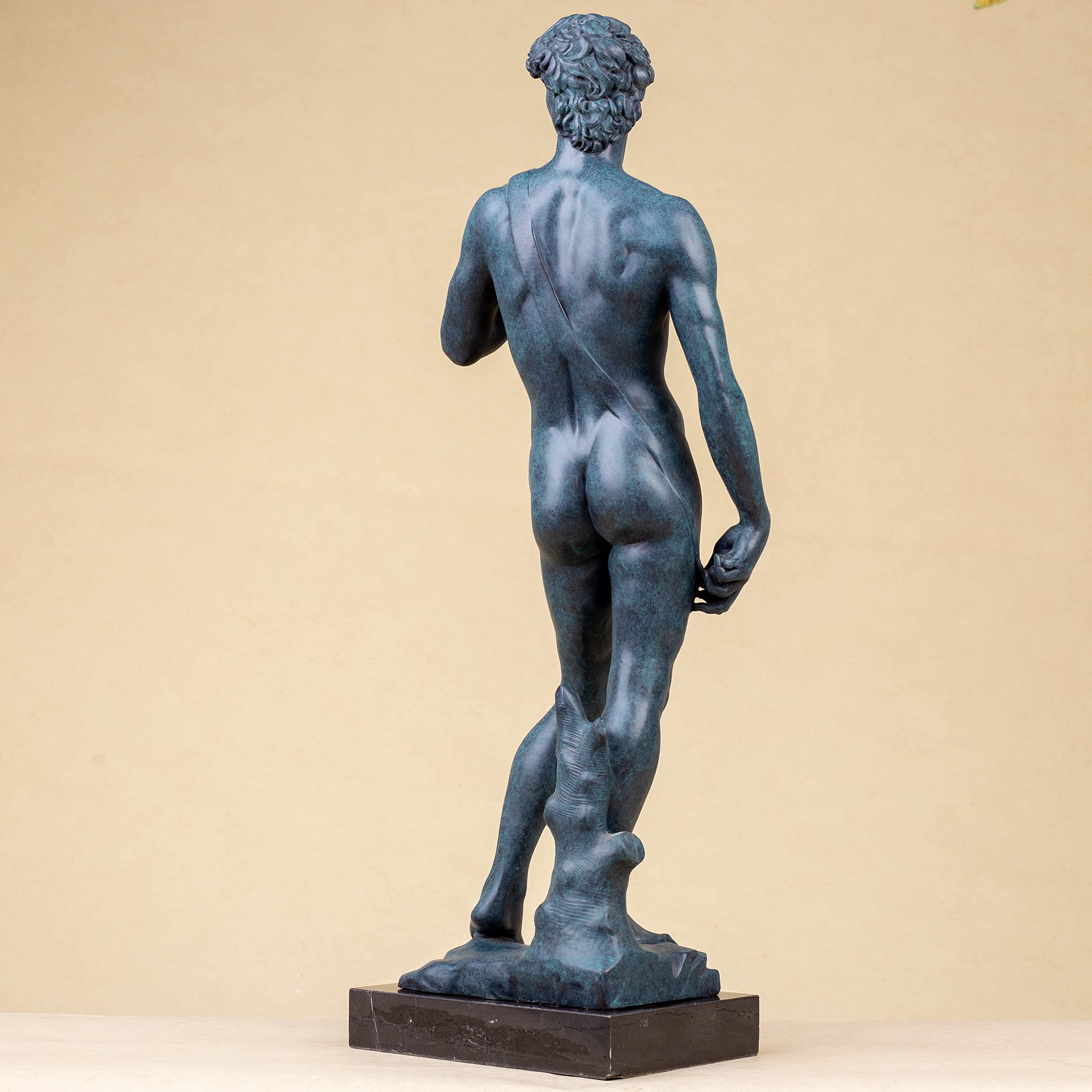David modern bronze statue left side view on beige background showing full figure profile