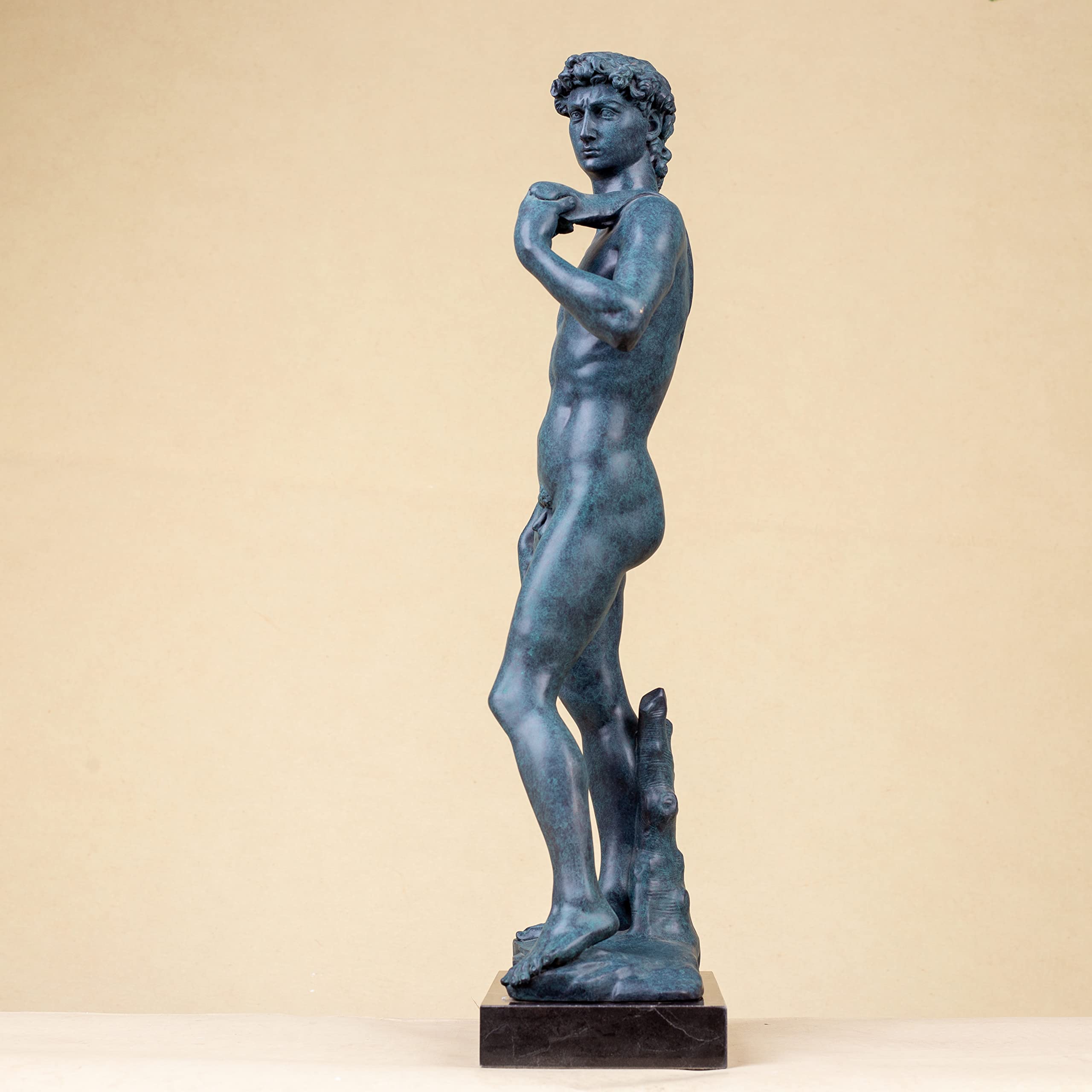 David modern bronze statue three-quarter angle view on beige background showing body and base detail